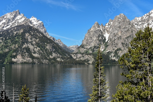 Jenny Lake Reflecting the Sky with Pine Trees and Mountains Surrounding, Grand Teton National Park, Wyoming
