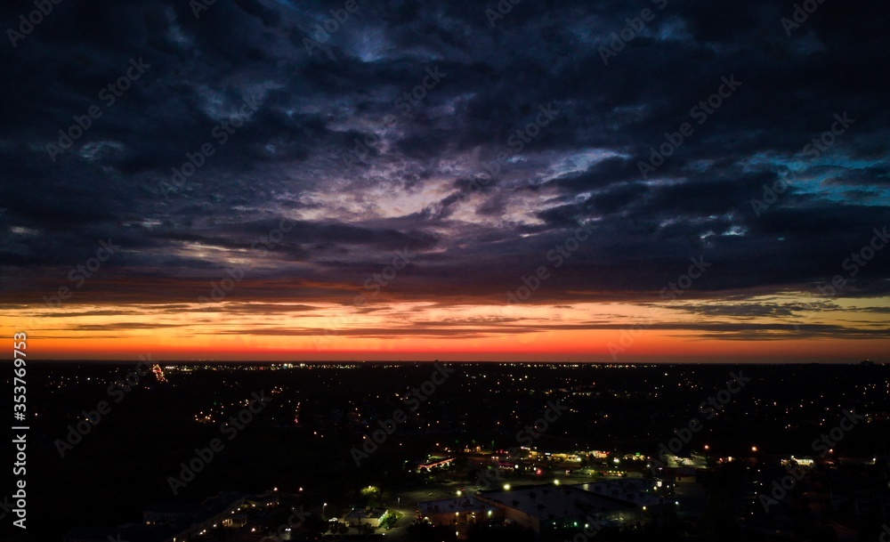 Aerial cityscape during dramatic sunset over Lexington, Kentucky