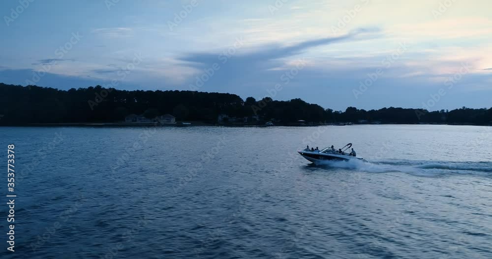 Speed boating at sunset, aerial drone shot, Lake Norman, NC Speed boating at sunset, aerial drone shot, Lake Norman, NC