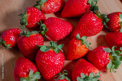 Fresh red strawberries on a wooden board