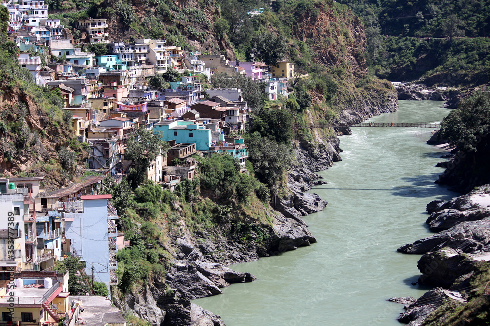 THE CITY ON THE BANK OF MOUNTAIN RIVER IN HIMALAYAS. DEVPRAYAG, UTTARAKHAND, INDIA, ASIA, 11TH OCTOBER, 2019