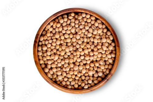 Closeup soy beans in wooden bowl  isolated on white background with clipping path. Overhead view. Flat lay.