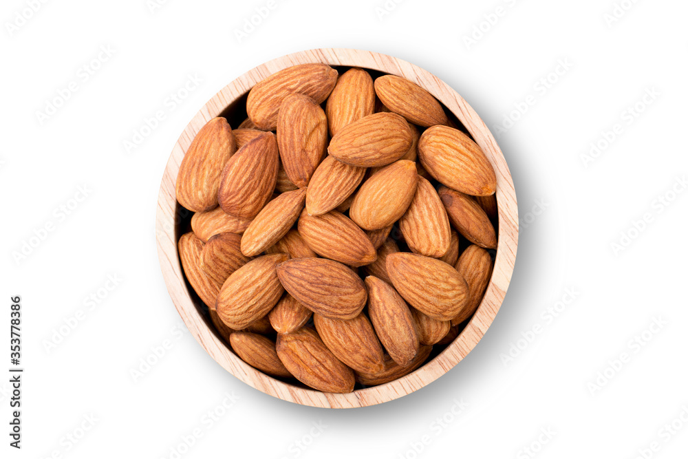 Closeup almond nuts in wooden bowl isolated on white background with clipping path. Overhead view. Flat lay. Closeup almond nuts in wooden bowl isolated on white background with clipping path. Overhead view. Flat lay.