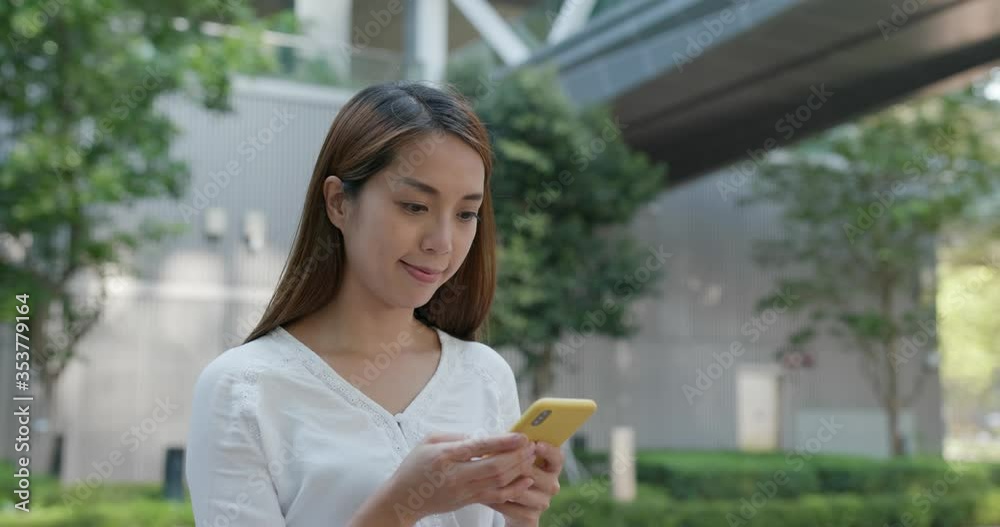 Woman use of mobile phone in city Woman use of mobile phone in city
