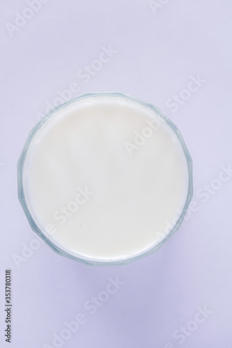 cup of cold milk on white background.