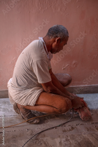 jaipur. Rajasthan. India - may 21, 2020 Asia people work hard about construction in factory with wearing mask (covid19 )