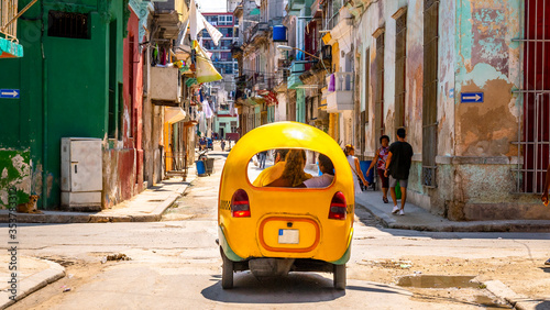 Passanger view of a moped taxi driver in Havana Cuba,  also know as 