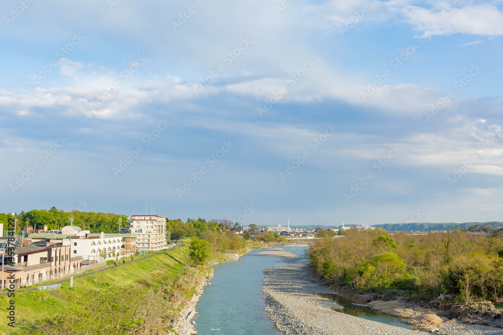 Flowing river and cloud spreading in the sky Flowing river and cloud spreading in the sky