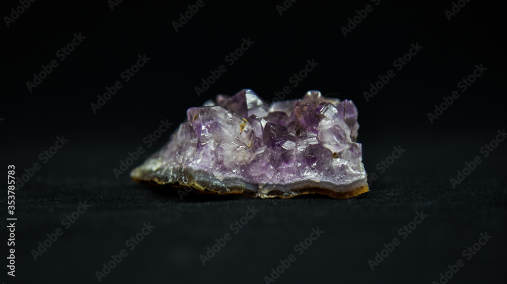 Purple crystal with a black background