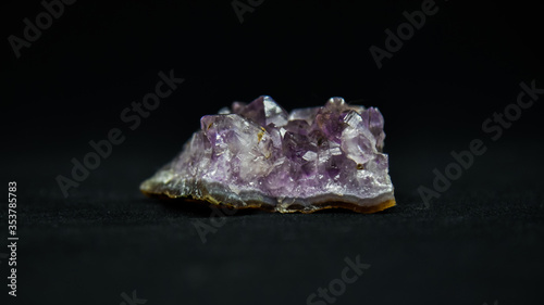 Purple crystal with a black background