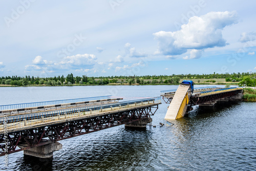 Bilde på lerret Destruction of bridge structures across the river with the collapse of sections