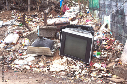 Television and electrical appliances on the road side garbage dustbin. photo