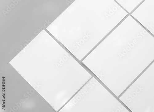 Poster white mock-ups paper isolated on gray background  Blank portrait paper A4. brochure  can use banners magazine products business texture.