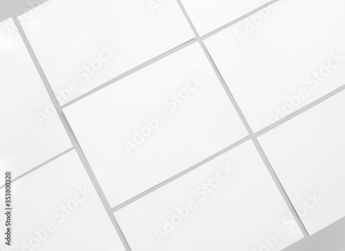 Fototapeta Naklejka Na Ścianę i Meble -  Poster white mock-ups paper isolated on gray background, Blank portrait paper A4. brochure, can use banners magazine products business texture.