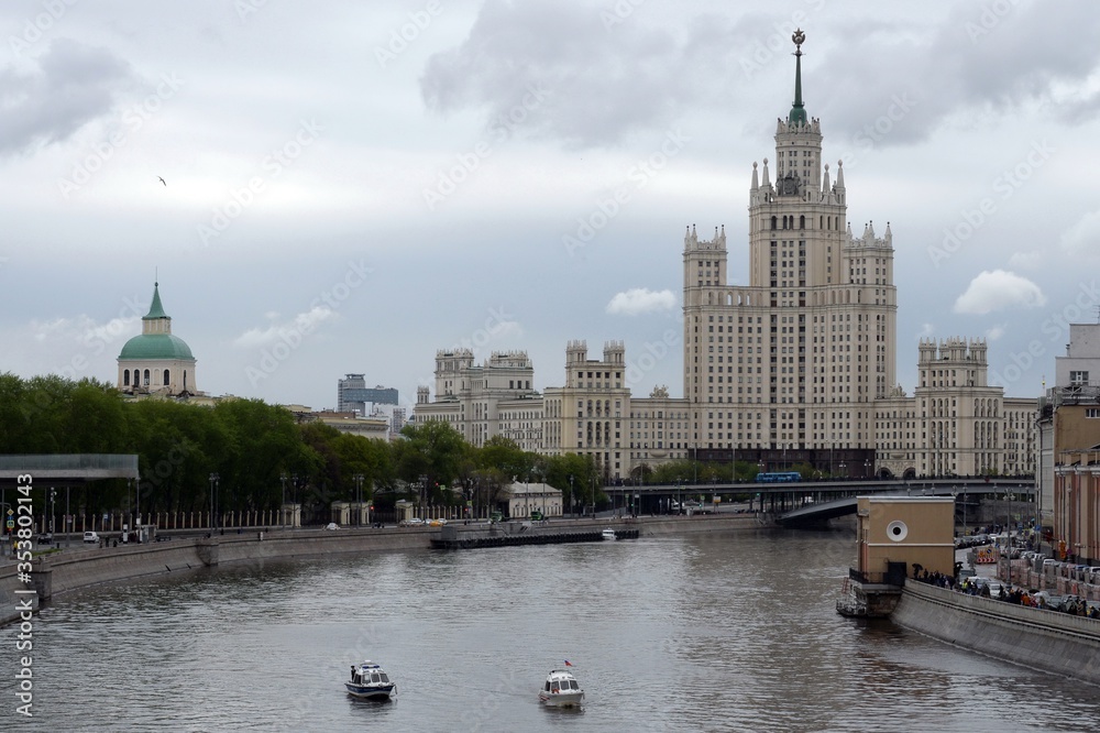 View from the Bolshoi Moskvoretsky bridge on a high-rise building on Kotelnicheskaya embankment of Moscow