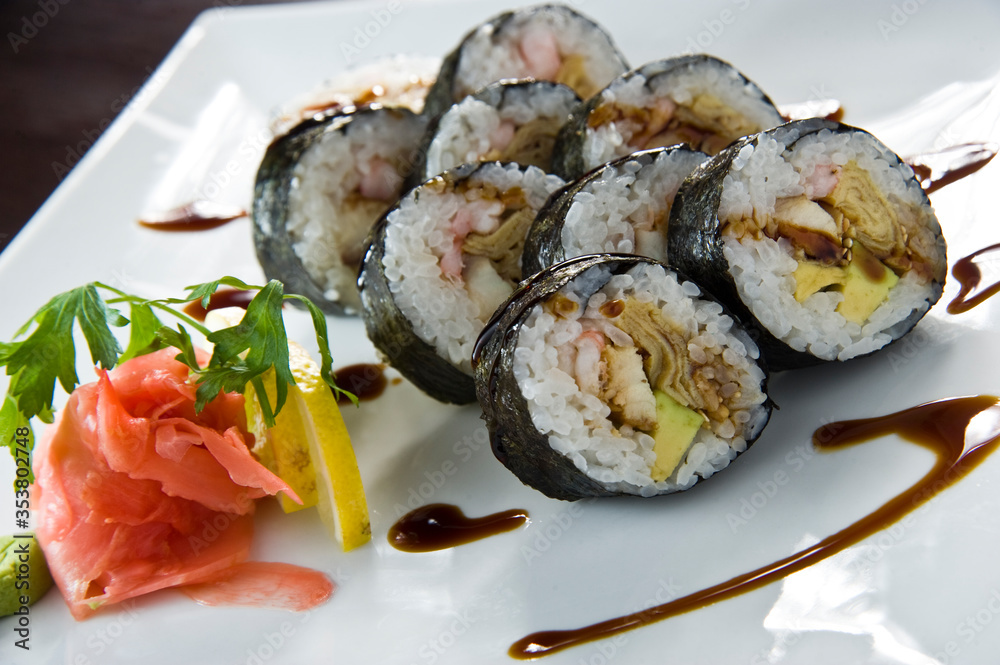 Sushi roll with salmon and shrimp tempura.