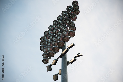 stadium lights on a blue sky