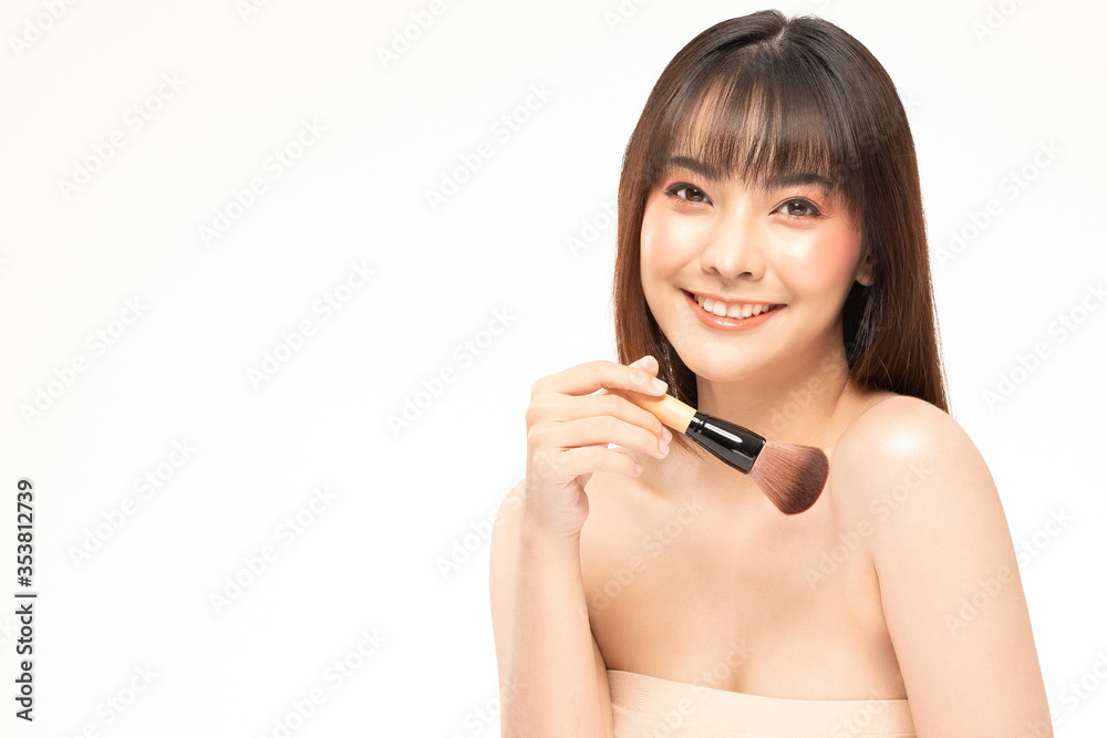 Beauty asian woman brown hair looking smile in camera happiness and hold make up brush and cheerful with make up brush,Beauty Concept on white background. Beauty asian woman brown hair looking smile in camera happiness and hold make up brush and cheerful with make up brush,Beauty Concept on white background.