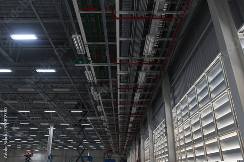 Fototapeta Lighting fixture ,fire protection pipe installation under pipe rack at Factory a