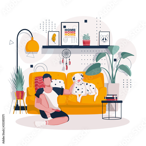 A man at home playing the console. Big white dog lying on the sofa. Rest at home with a pet in the living room on the sofa. Interior of the room.