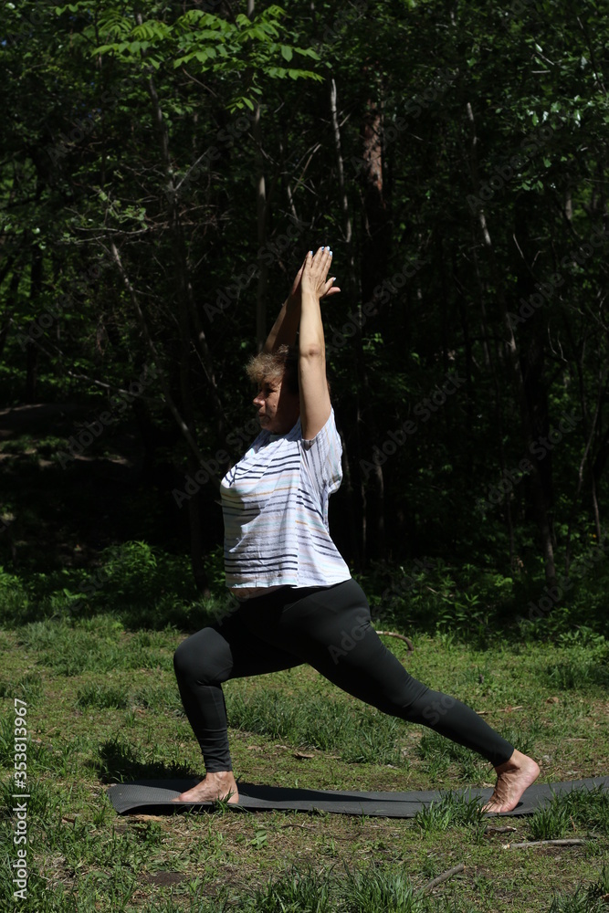 Senior woman doing sport and physical exercises outdoor Senior woman doing sport and physical exercises outdoor