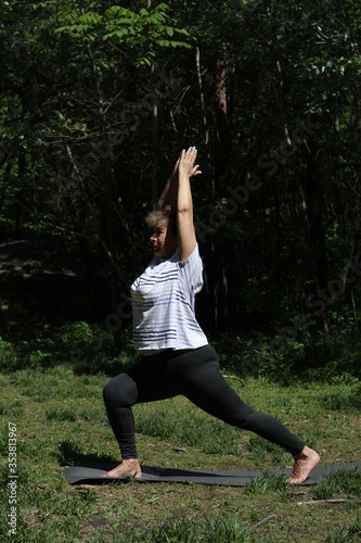 Senior woman doing sport and physical exercises outdoor