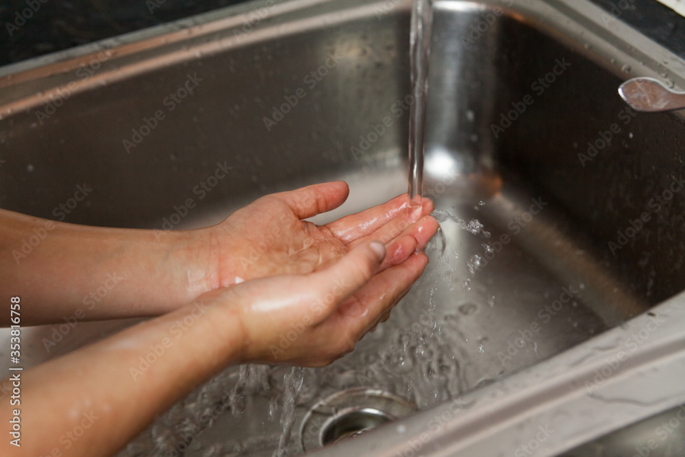 washing hands in the kitchen