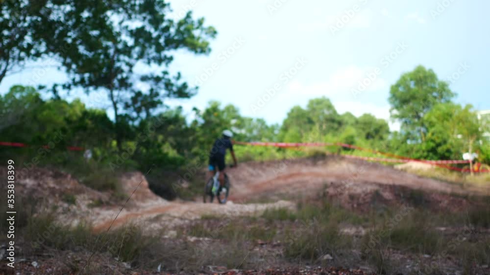 blur defocus of cyclist ride mountain bike in forest for healthy and leisure at day time blur defocus of cyclist ride mountain bike in forest for healthy and leisure at day time