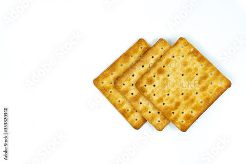 Cream cracker biscuit isolated on white background with copy space.