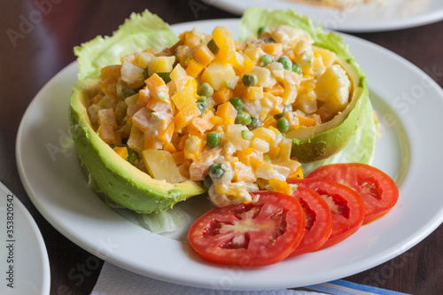 Latin American salad of vegetables and fruits in avocado