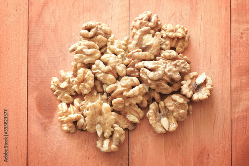 Walnuts on a wooden table.