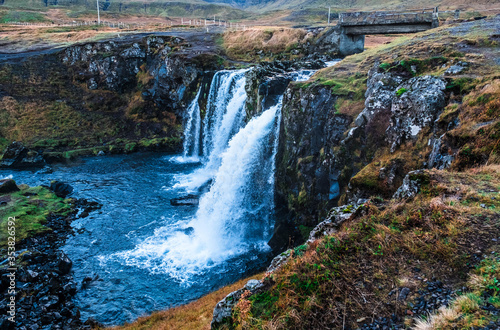 Kirkjufellfoss waterfall in the town of Grundarfjorur in western Iceland 