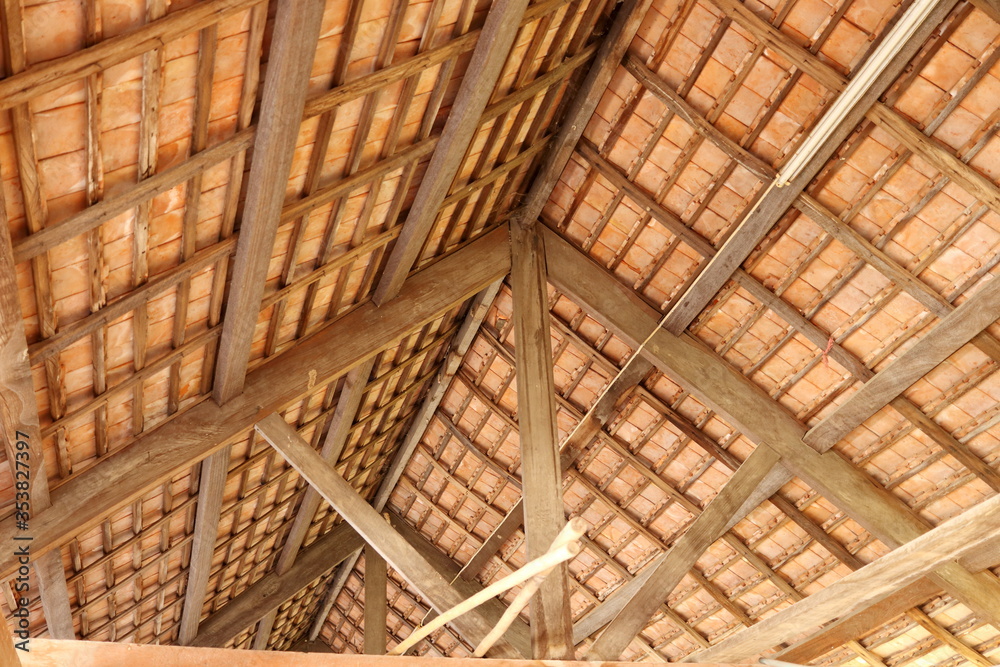 Thai style under roof of ancient building, brown wood construction and roof tiles of under roof, Thailand. Thai style under roof of ancient building, brown wood construction and roof tiles of under roof, Thailand.