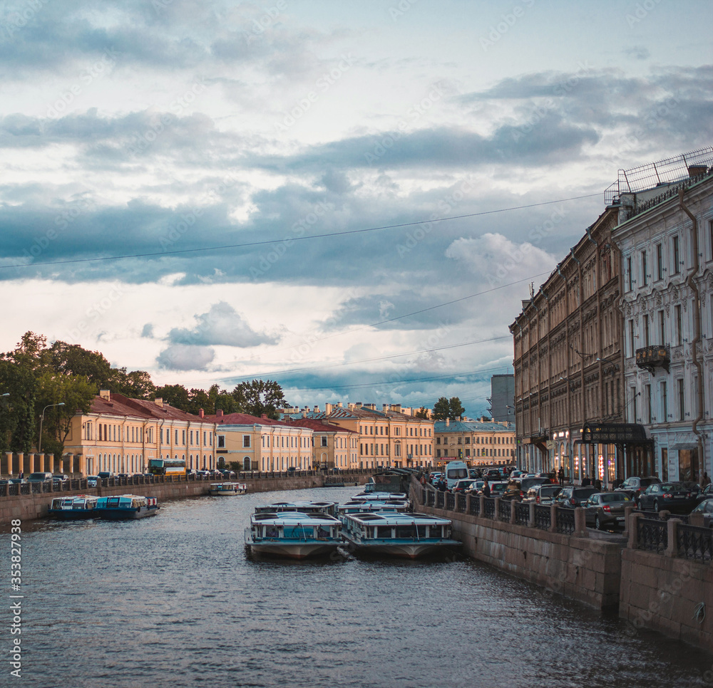 St. Petersburg, Russia - June 5, 2019, view of the bridge over the Griboedov Canal and the river on Nevsky Prospect, the tourist historical center of the city, boat and boat trip