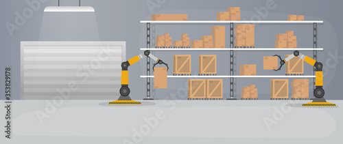 Production warehouse with boxes and pallets. Robotic arm works in a warehouse. Robot arm lifts boxes.