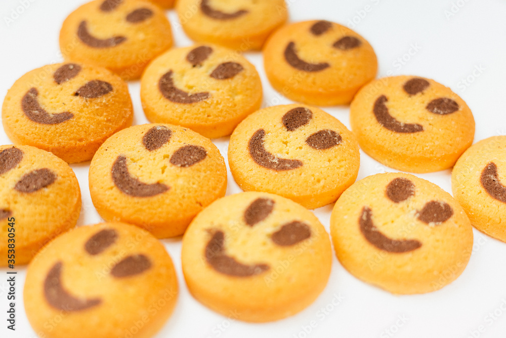 A set of smiling biscuit cookies isolated on white background with copy space. Smile concept. Sweet greeting