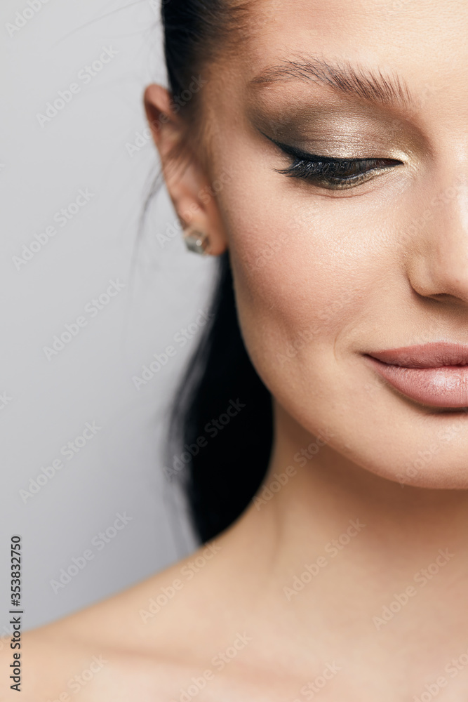 Beautiful face of young woman with clean fresh skin close up isolated on the grey background. Beauty portrait. Perfect fresh skin. Pure beauty model. Youth and skin care concept Beautiful face of young woman with clean fresh skin close up isolated on the grey background. Beauty portrait. Perfect fresh skin. Pure beauty model. Youth and skin care concept