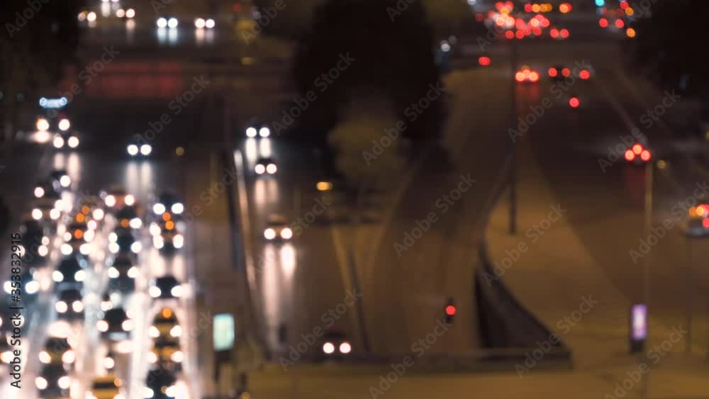 Defocused city car traffic on a busy street in downtown Madrid. Night traffic in central Madrid bokeh. Suitable for background video. Defocused city car traffic on a busy street in downtown Madrid. Night traffic in central Madrid bokeh. Suitable for background video.