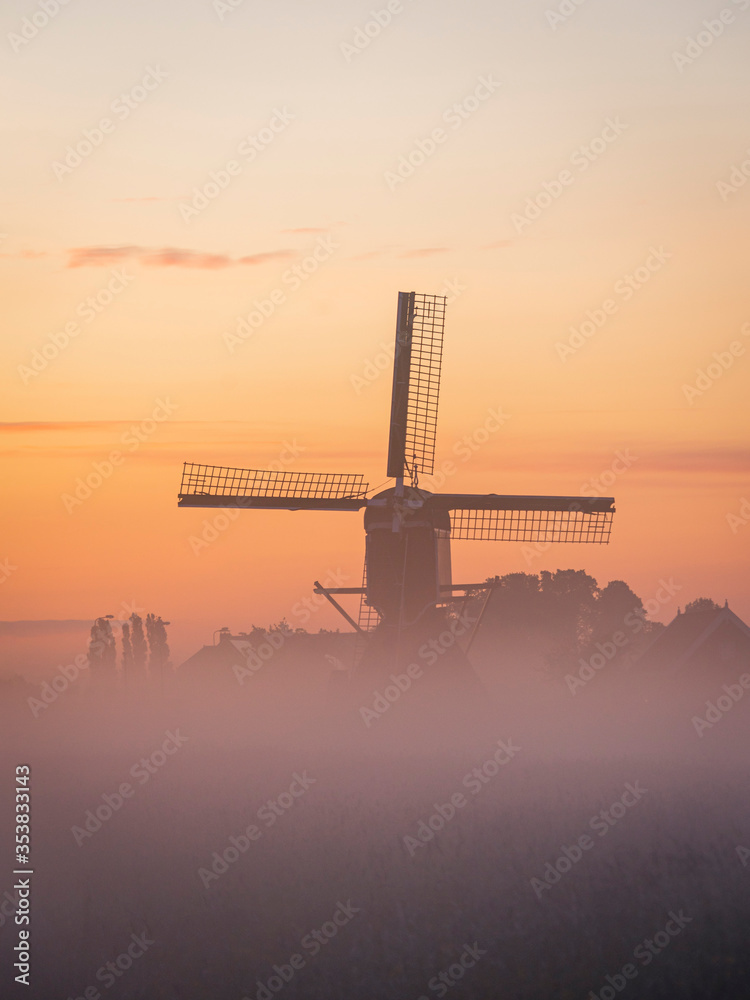 windmill in the morning-mist
