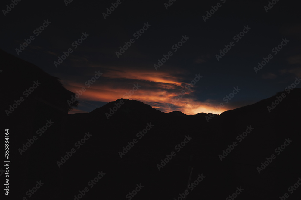 Cloudy sunset in a mountainous region Cloudy sunset in a mountainous region