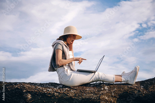 young woman with laptop. Work. Working. 