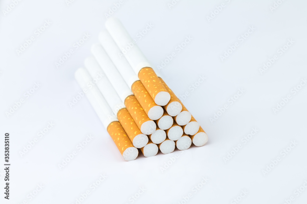 Closeup of many cigarettes The cigarette end is brown and the tip is white. Arranged in a triangle On a white background Closeup of many cigarettes The cigarette end is brown and the tip is white. Arranged in a triangle On a white background