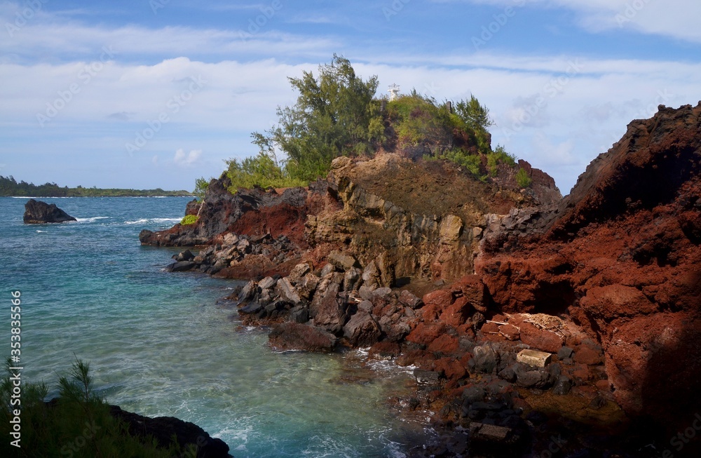 Colorful rocky bay with turquoise water at Hana, Maui, USA