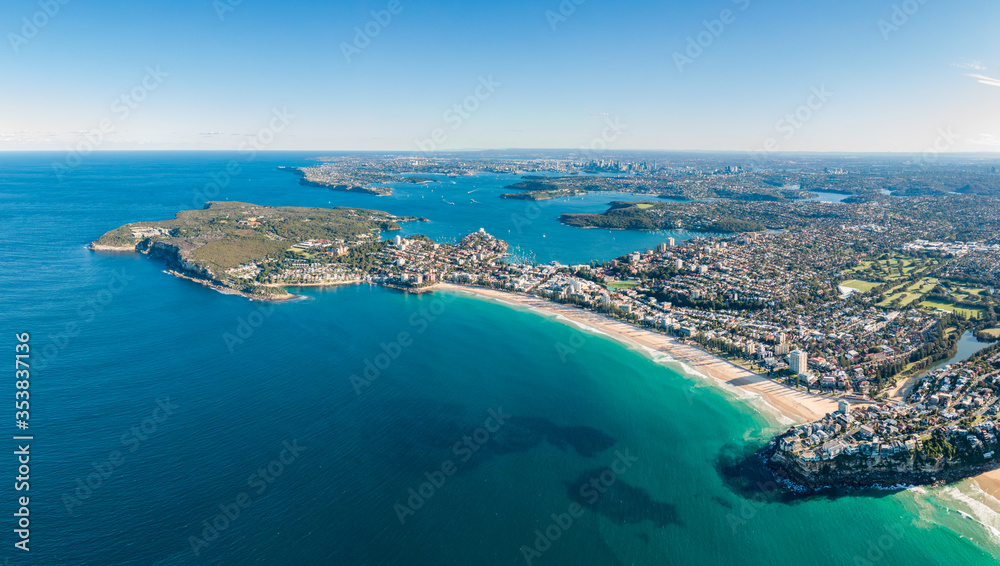 High resolution panoramic high angle drone view of Manly Beach, North Head and the Sydney Harbour area. Manly is a popular suburb of Sydney, New South Wales, Australia. Famous tourist destination.