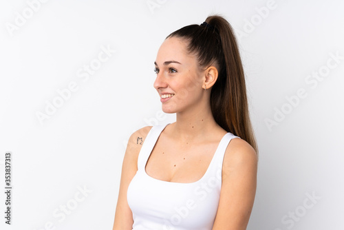 Young brunette woman over isolated white background . Portrait