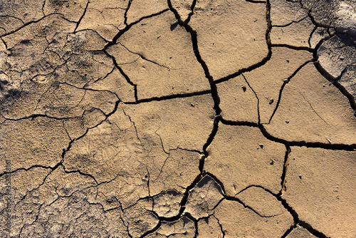 Dry lake or swamp in the process of drought and lack of rain or moisture, a global natural disaster. The cracked soil of the earth due to climate change. Hydrological drought, ccological catastrophy