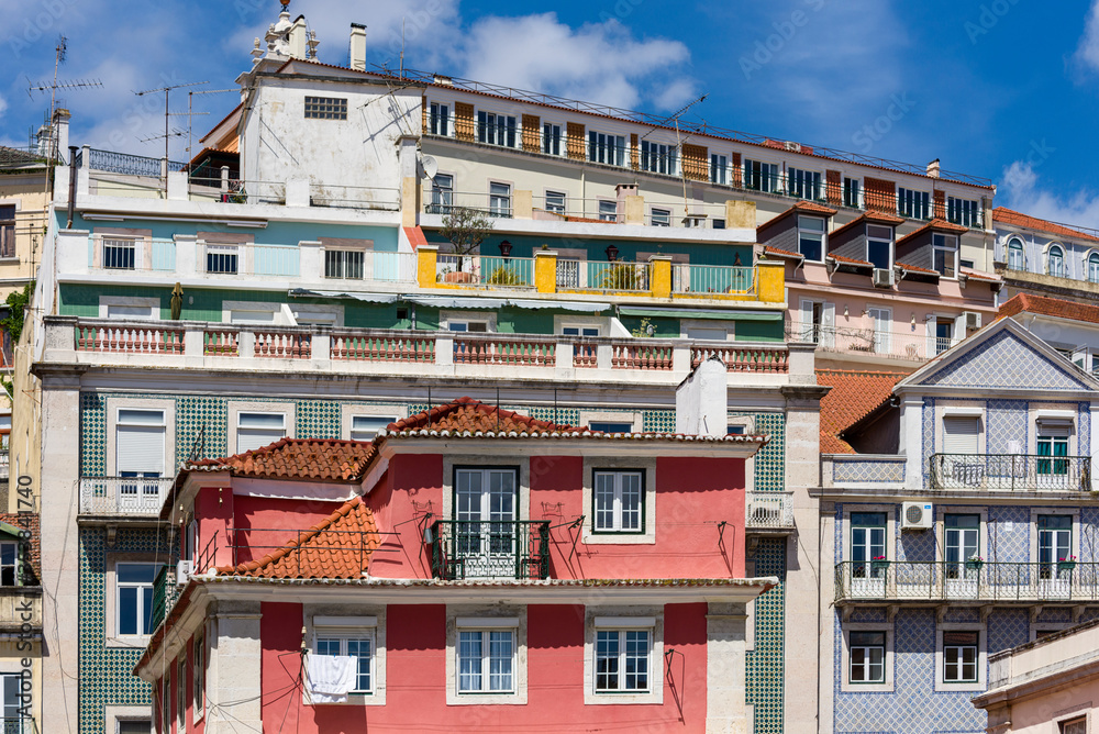 facade covered with azulejos on old houses in Lisbon