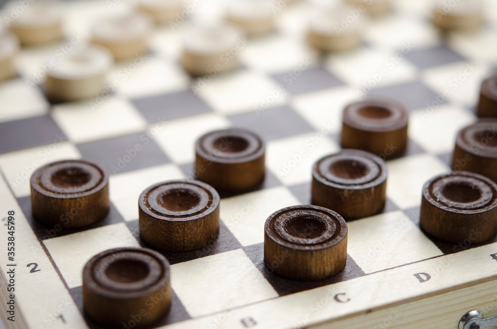 Party of wooden checkers close up. The strategy Party of wooden checkers close up. The strategy