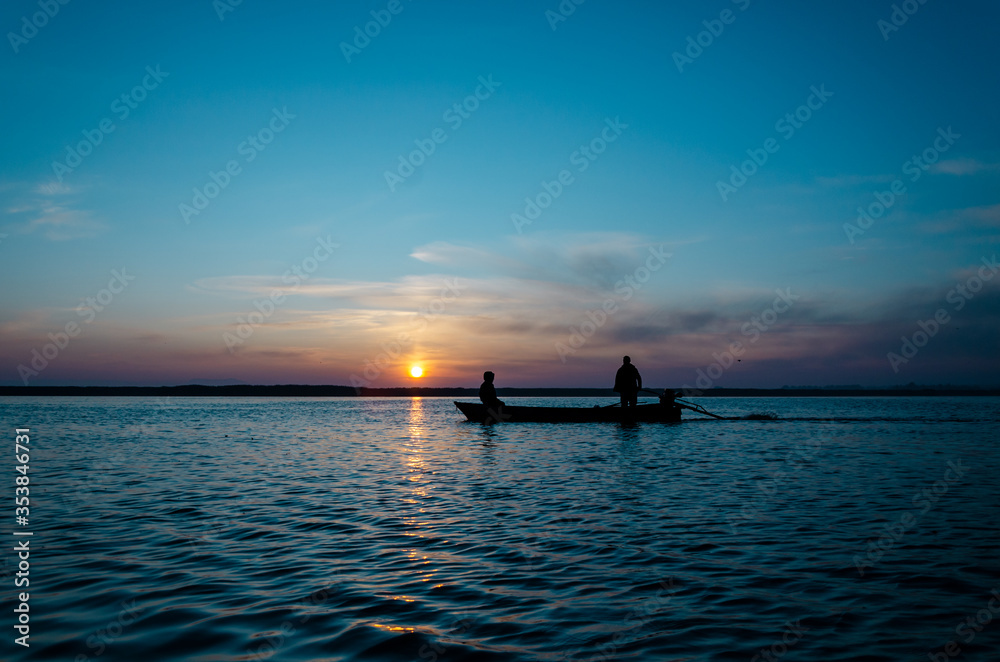 The fishermen and boat silhouette