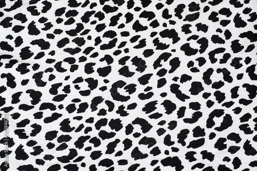 Black spots of different shapes on white background - imitation of dolmatine dog skin